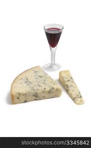 Stilton cheese with a glass of port on white background