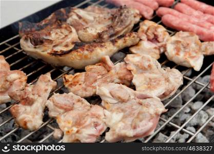 Stilts raw chicken and sausages on the barbecue