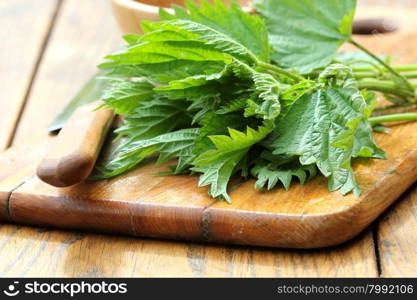 stinging nettle on a cutting board