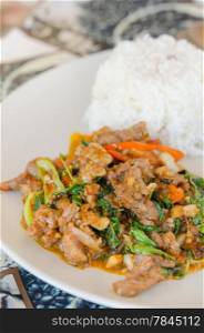 stir fried beef , curry sauce and vegetable served with steamed rice
