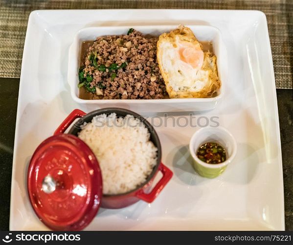 Stir fried beef with basil and steamed rice and fried egg