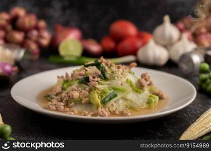 Stir Fried Chinese Cabbage with Minced Pork in White Dish. Selective focus.