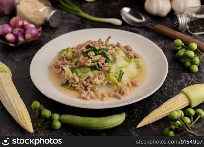 Stir Fried Chinese Cabbage with Minced Pork in White Dish. Selective focus.
