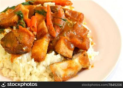 Stir fried crispy pork with red curry paste and rice