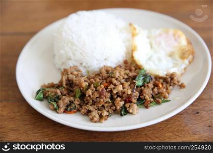 Stir fried pork and basil served with rice and fried egg