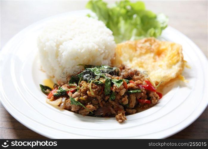 Stir fried pork and basil served with rice and fried egg