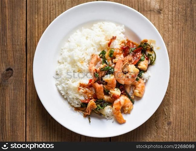 Stir fried shrimp, Cooked rice and fried basil with shrimps prawns,Thai food rice topped shrimp with holy basil leaves