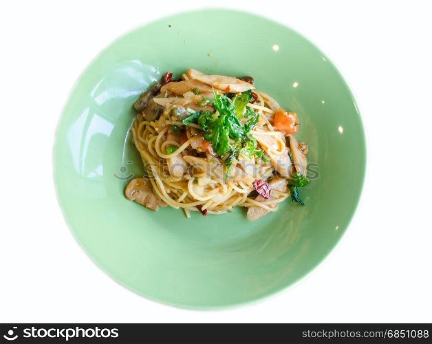 stir-fried spicy spaghetti with sausage and basil on white background
