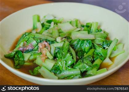 stir fried vegetable . stir fried green vegetables with sauce on plate