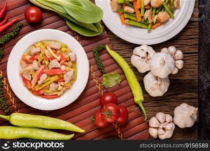 Stir-fried with bell peppers, pork, crab sticks and mushrooms.