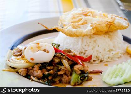 stir fry squid , mince pork and fried egg over rice