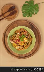 Stirred Fried seafood with Garlic, Pepper, Curry Powder and vegetable on dish. stir fried herbal vegetables with seafood and curry powder