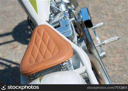 stitched leather saddle on low rider chopper motorcycle