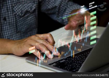 Stock market chart business using a computer to analyze online trading data.Forex graph  financial and investment on a virtual screen concept.