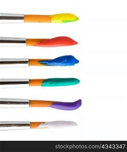 Stock photo: an image of a set of paintbrushes with paints