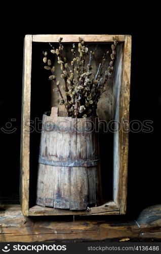 Stock photo: an image of a willow broom in a wooden pail
