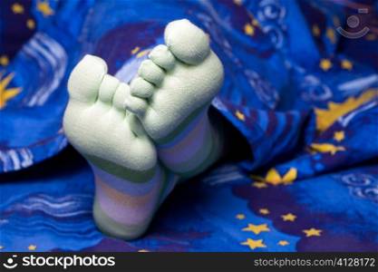 Stock photo: an image of funny feet in striped socks