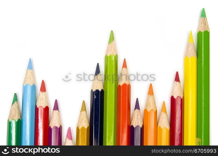 Stock photograph of brightly colored pencils forming aasymmetric pattern.