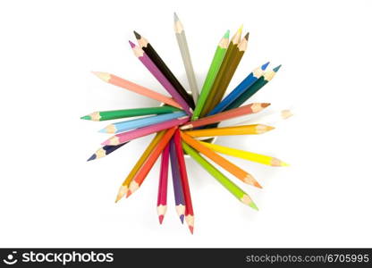 Stock photograph of brightly colored pencils forming aasymmetric pattern.