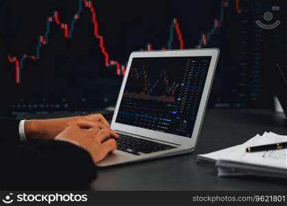 Stock trading investor monitoring dynamic financial data graph for profitable trade. Businessman or broker with analytic thinking analyzing data for stock market exchange trading company. Trailblazing. Stock trading investor monitoring dynamic financial data graph. Trailblazing