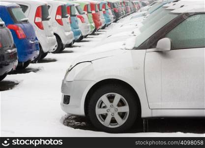 Stocked cars covered with snow in winter