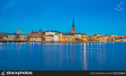 Stockholm city skyline with view of Gamla Stan at night in Stockholm, Sweden.