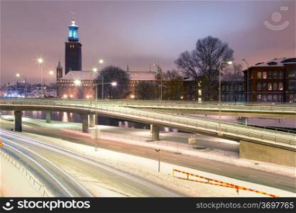 Stockholm Cityhall at night with transportation light trail Sweden