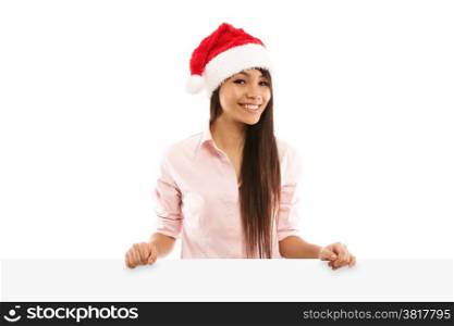 Stockphoto of Asian smiling woman with christmas hat looking towards the camera with white paper board on white isolated background