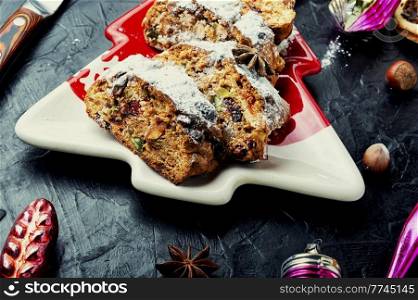 Stollen is a traditional German Christmas pastry. Seasonal cake. Stollen, a German Christmas pie