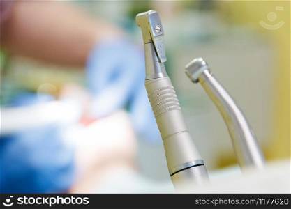 Stomatological tool kit. Closeup hightech Dentist equipments. Dental treatment at the dentist, a client sitting in a dental chair.. Stomatological tool kit. Closeup hightech Dentist equipments. Dental treatment at the dentist, a client sitting in a dental chair