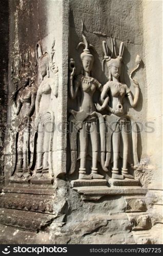 Stone apsaras on the corner of Angkor wat, Cambodia