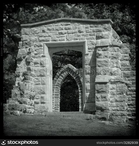 Stone archway seen through a stone archway, Kingsmere, Gatineau Park, Canada.