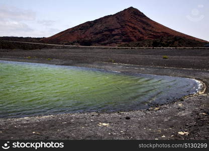 stone atlantic ocean sky water lanzarote in el golfo spain musk pond rock coastline and summer