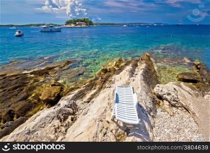 Stone beach of Island Hvar with Paklinski island yachting destination view, Dalmatia, Croatia