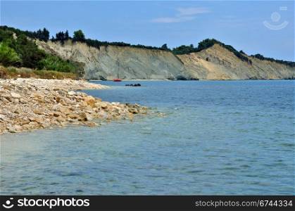 Stone beach seaside and eroded coastal ridges at the island of Zakynthos, Greece.