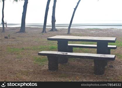 stone bench with sea in the background
