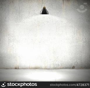 Stone blank wall. Stone blank wall illuminated with hanging above lamp. Place for text