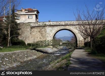 Stone bridge on the river in Bursa, Turkey
