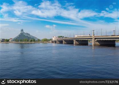 Stone bridge over Daugava river in Riga in a beautiful summer day, Latvia