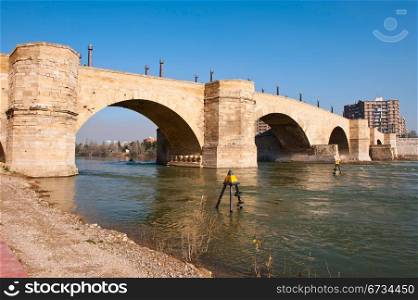 Stone Bridge Over The River Ebro In Zaragoza, Spain
