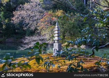 Stone buddha at carvings are inside the garden of Kinkakuji Temple Kyoto, Japan.