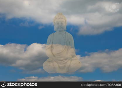 Stone Buddha statue . Stone Buddha statue on a blue sky and cloud background