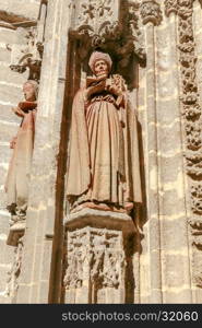 Stone carving and sculptures on the walls of the cathedral in Seville.. Sevilla. Sculptures on Cathedral.