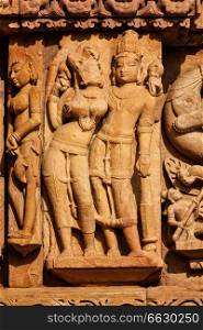 Stone carving bas relief sculptures on Adinath Jain Temple, famous indian tourist site Khajuraho, Madhya Pradesh, India. Sculptures on Adinath Jain Temple, Khajuraho