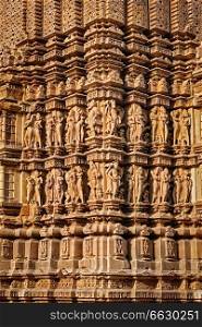 Stone carving bas relief sculptures on Vaman Temple, famous indian tourist site Khajuraho, Madhya Pradesh, India. Sculptures on Khajuraho temples