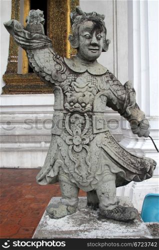 Stone chinese statue in the wat Suthat, Bangkok, Thailand