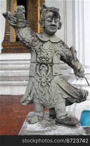 Stone chinese statue in the wat Suthat, Bangkok, Thailand
