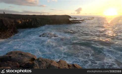 Stone cliffs, ocean waves and oceanscape. Punta jandia, Fuertaventura, Spain