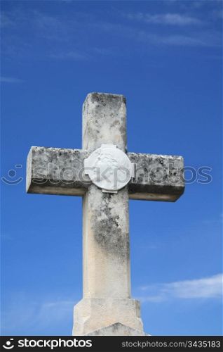 Stone cross grave ornament on an old cemetery in the Provence, France