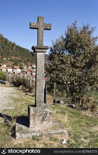 Stone cross, symbol of faith of the people of Gavieira village in the Peneda Mountain, North of Portugal